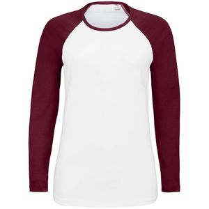 Женская двухцветная футболка с боковыми швами, длинным рукавом реглан и закругленным низом. Вырез горловины отделан резинкой с эластаном.  